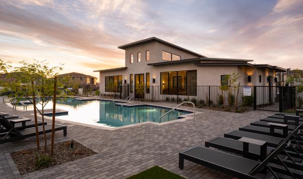 Community pool area with ample lounge chairs